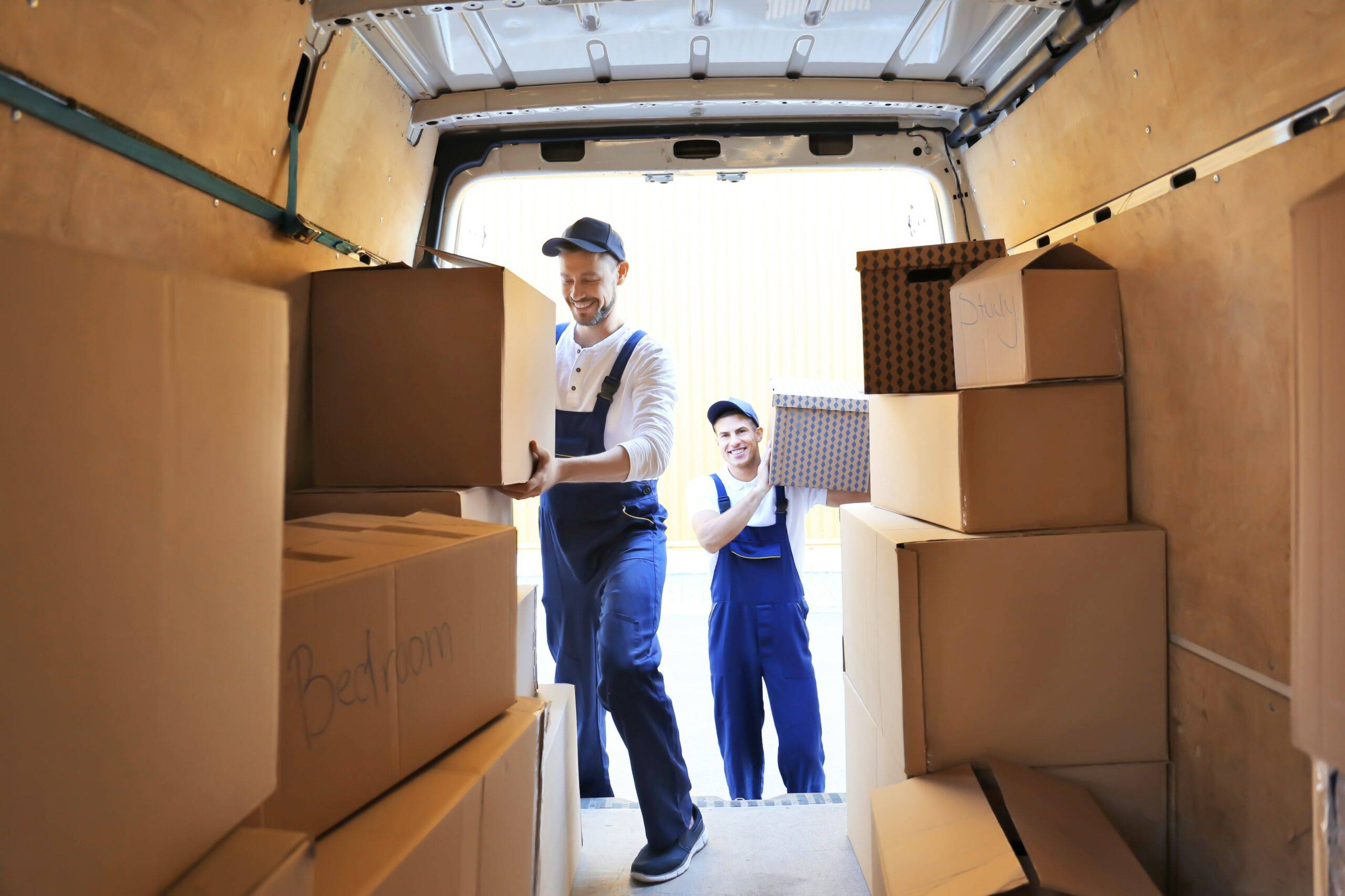 bigstock-Delivery-men-unloading-moving--219881824-min_1598954849